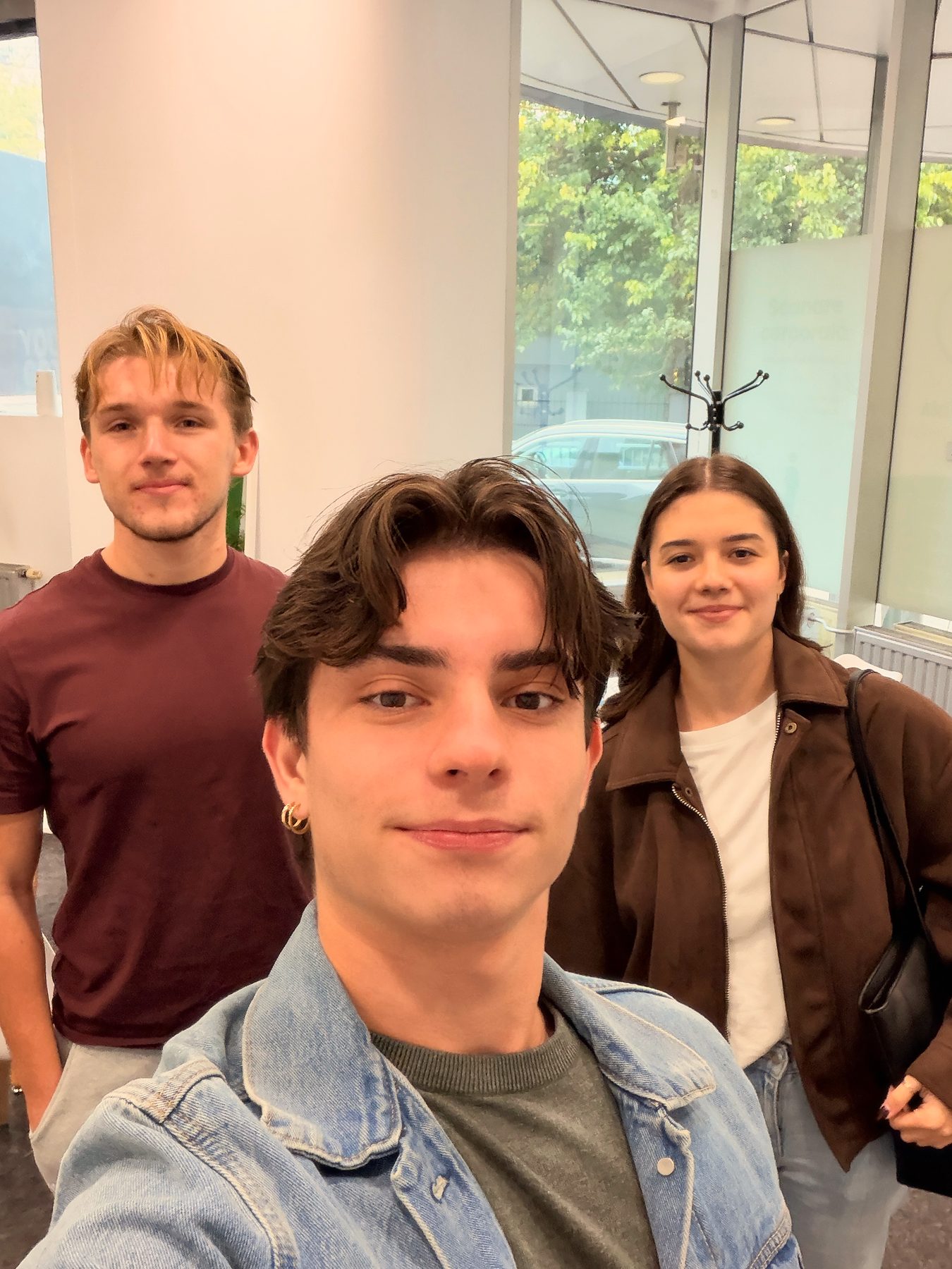 Gabriel with two friends at Boost Club